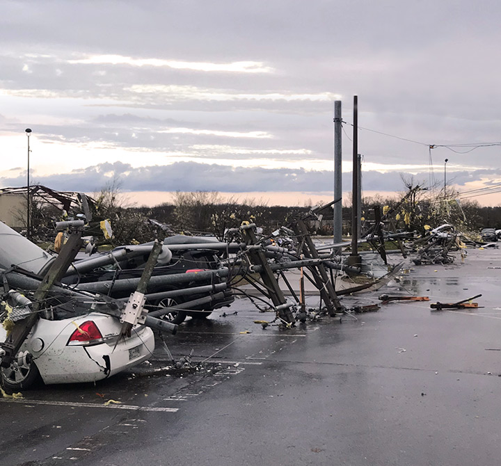 Disaster scene with cars and powerlines down