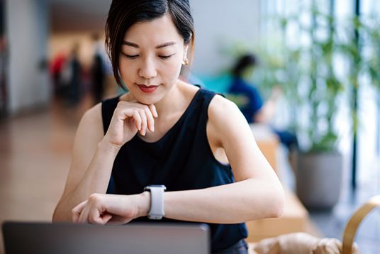 Woman looking at her smart watch